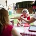 Karen Taracks wipes down dirty trays with others at the German Picnic on Saturday, June 29. Daniel Brenner I AnnArbor.com